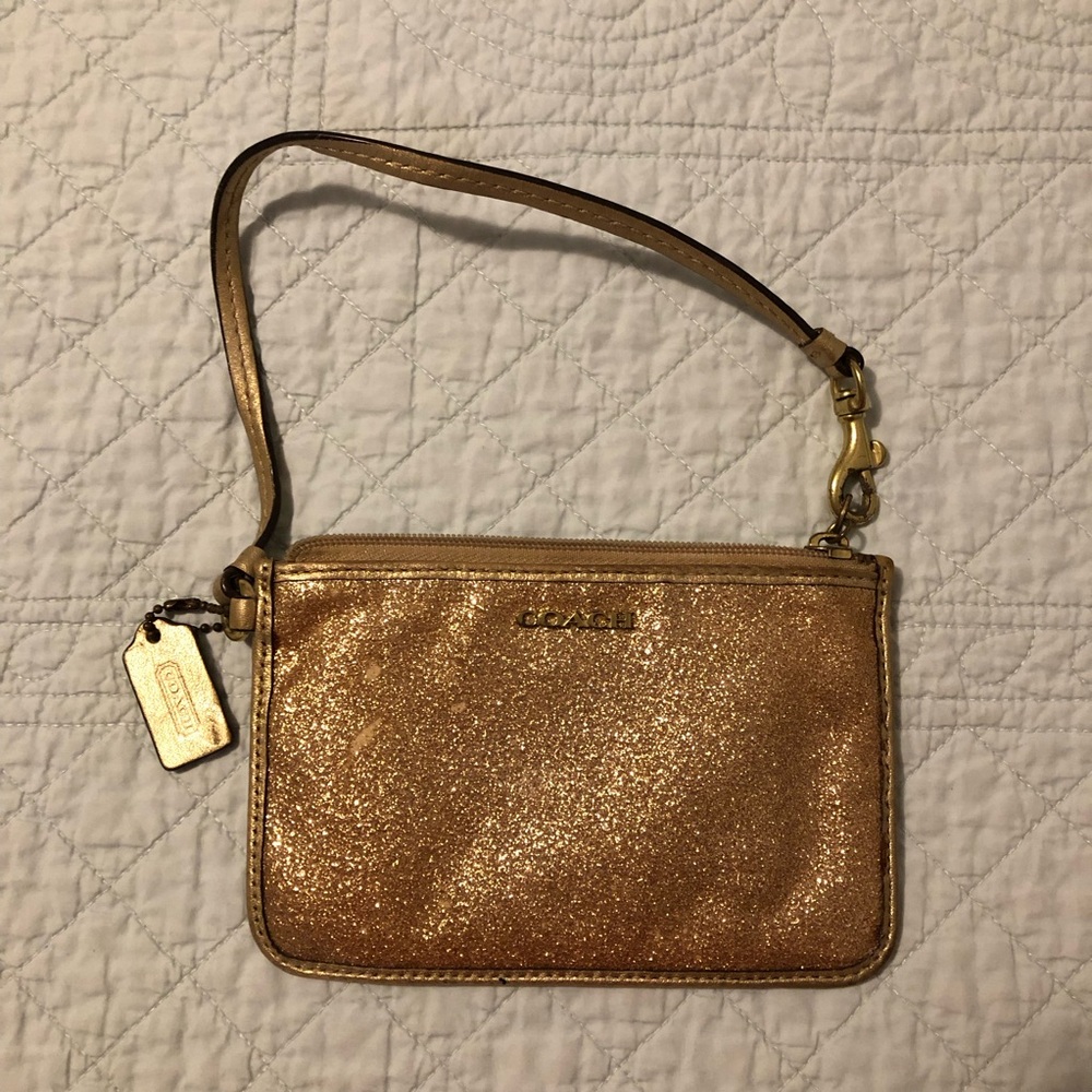 Coach gold shimmer wristlet.